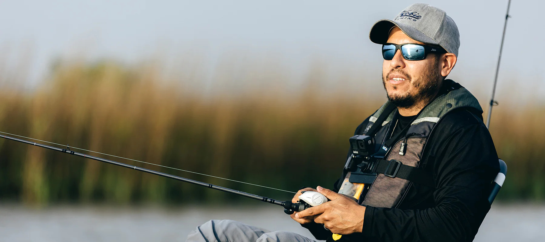 man fishing while wearing Hobie Snook sunglasses